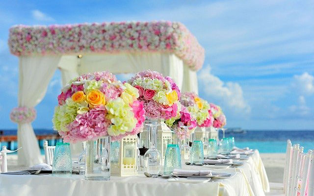 A wedding reception set up on a tropical beach