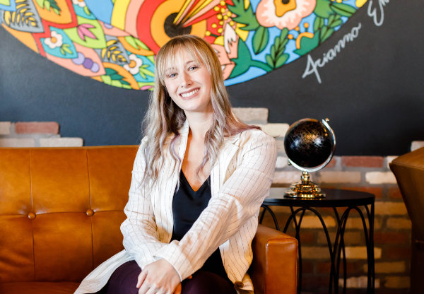 Headshot of Allie Johnson in a coffee shop.